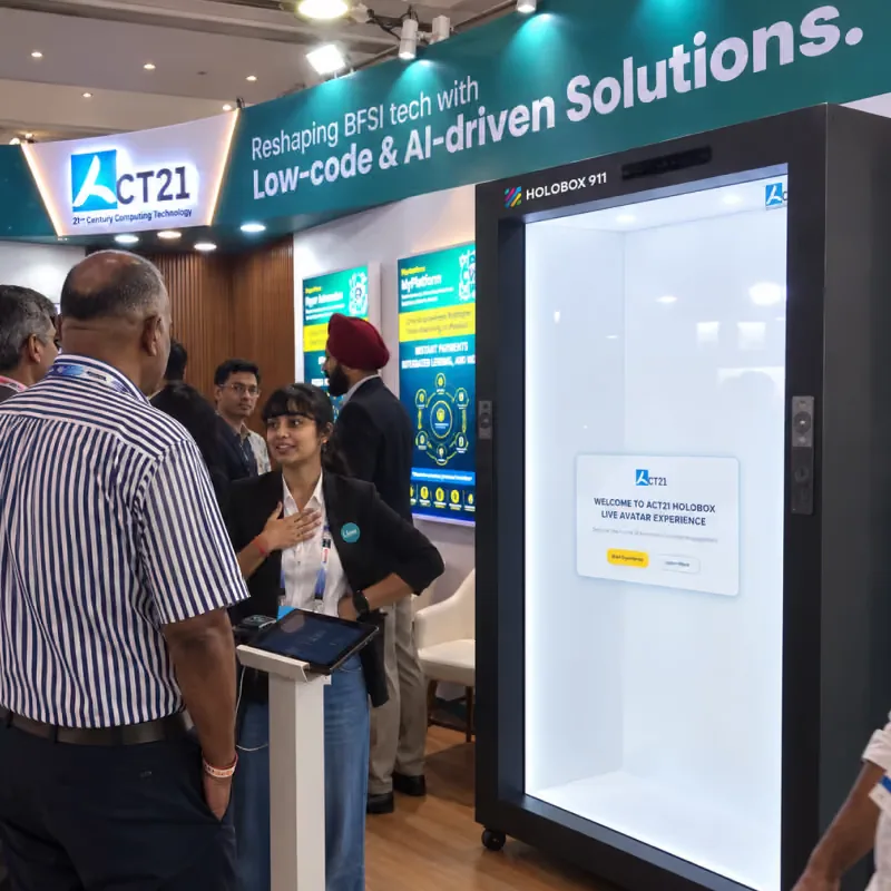 Booth team welcoming visitors next to a HoloBox911